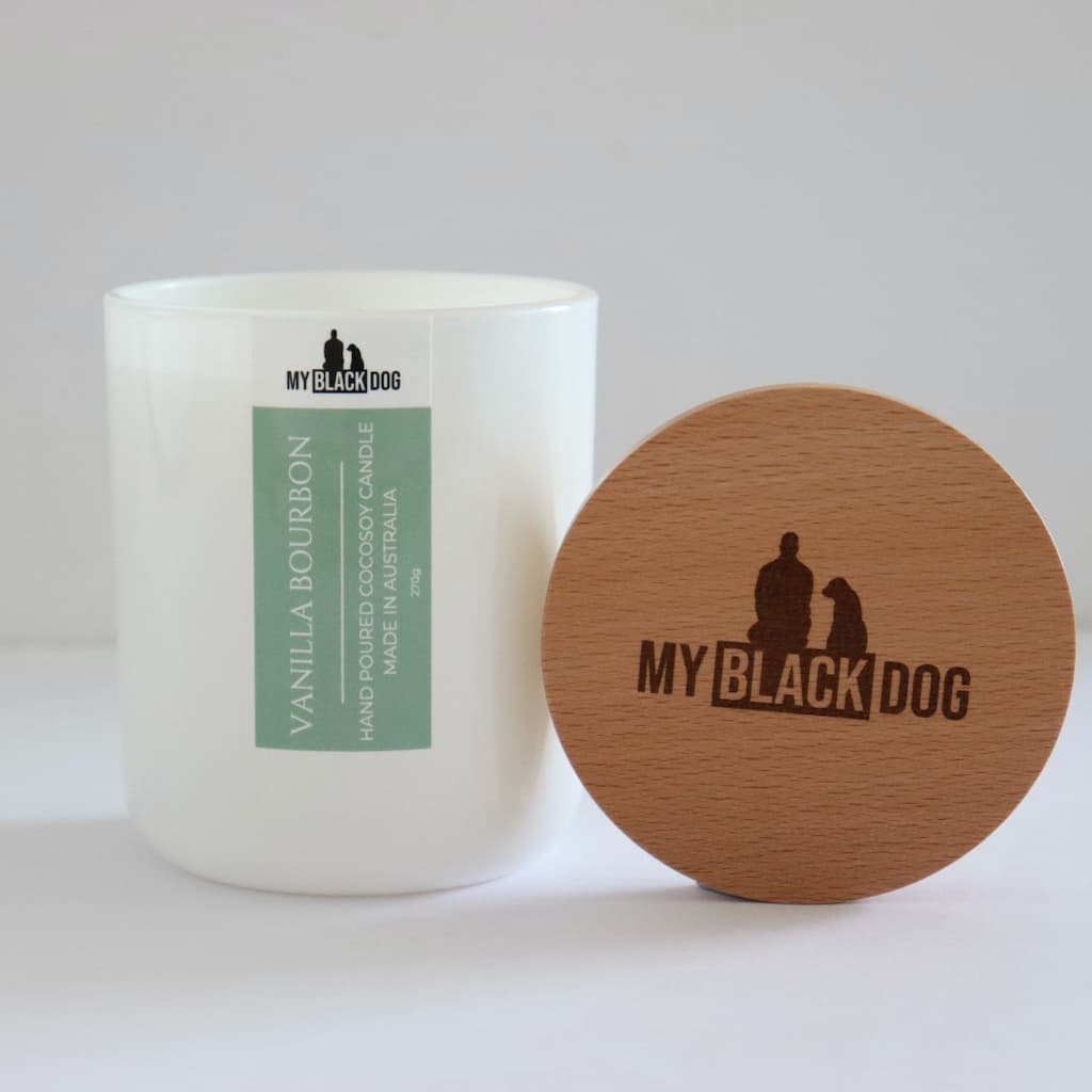 My Black Dog Vanilla Bourbon CocoSoy Candle in a white jar with timber lid