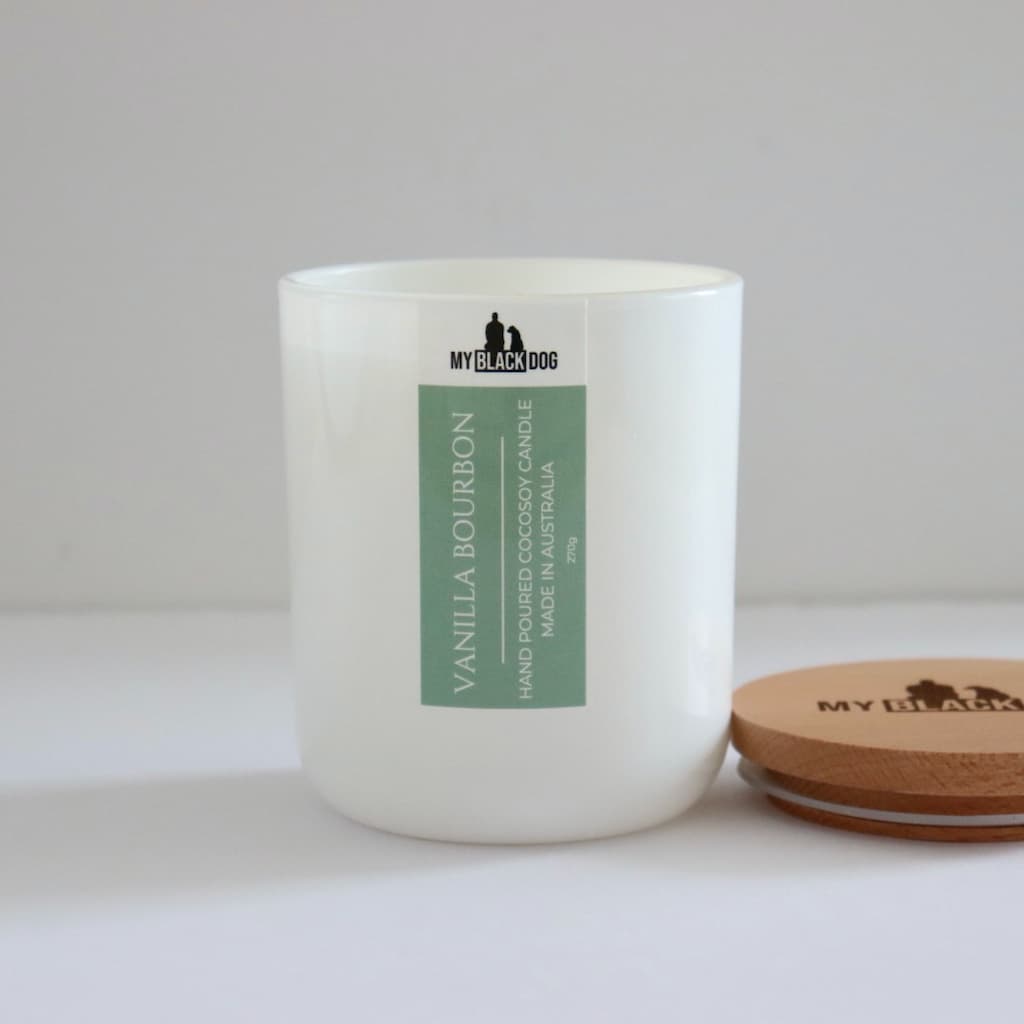My Black Dog Vanilla Bourbon CocoSoy Candle in a white jar with timber lid